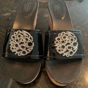 Coach black patent cork wedge shoe.